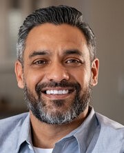 a man with beard smiling - Eotcranesinindia